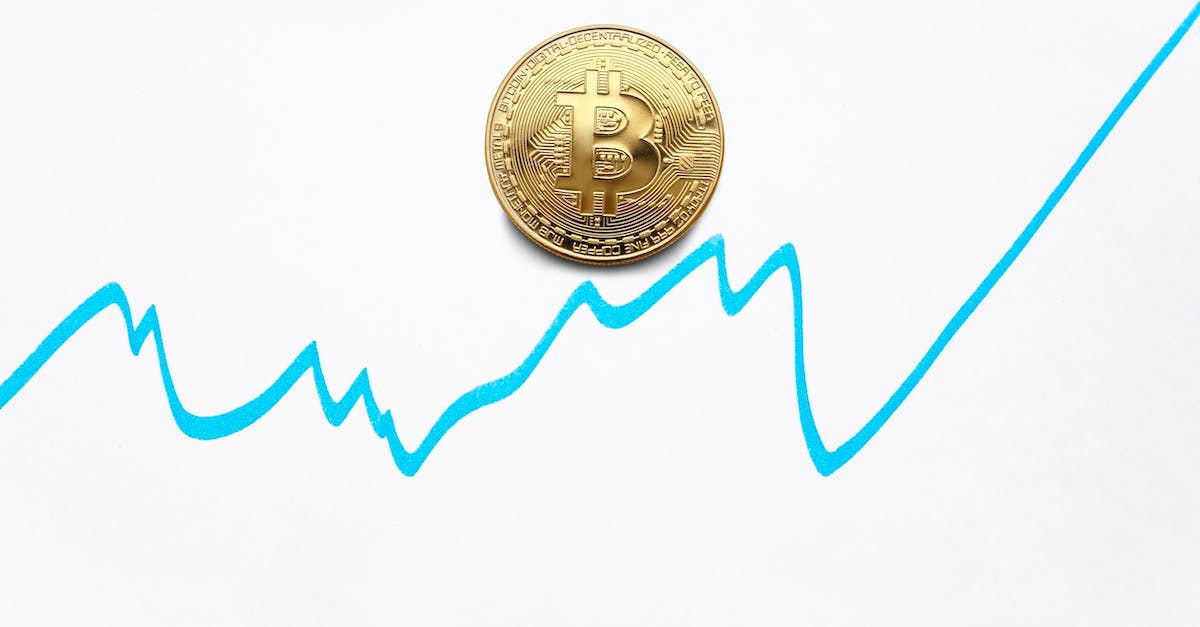 gold-bitcoin-cryptocurrency-coin-and-blue-graph-of-changes-of-value-on-white-background-1