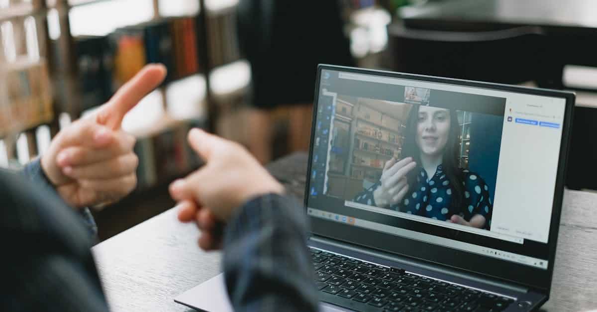 young-lady-learning-sign-language-during-online-lesson-with-female-tutor-1