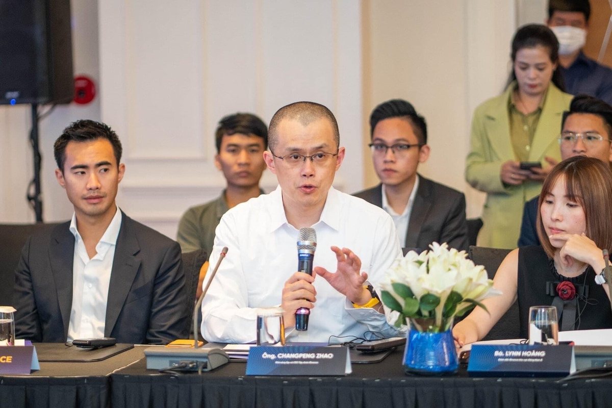 Binance Hack: What It Means for Crypto Casino Players 3 Binance founder Changpeng Zhao speaking into a microphone at a panel table at the Vietnam NFT Summit 2022
